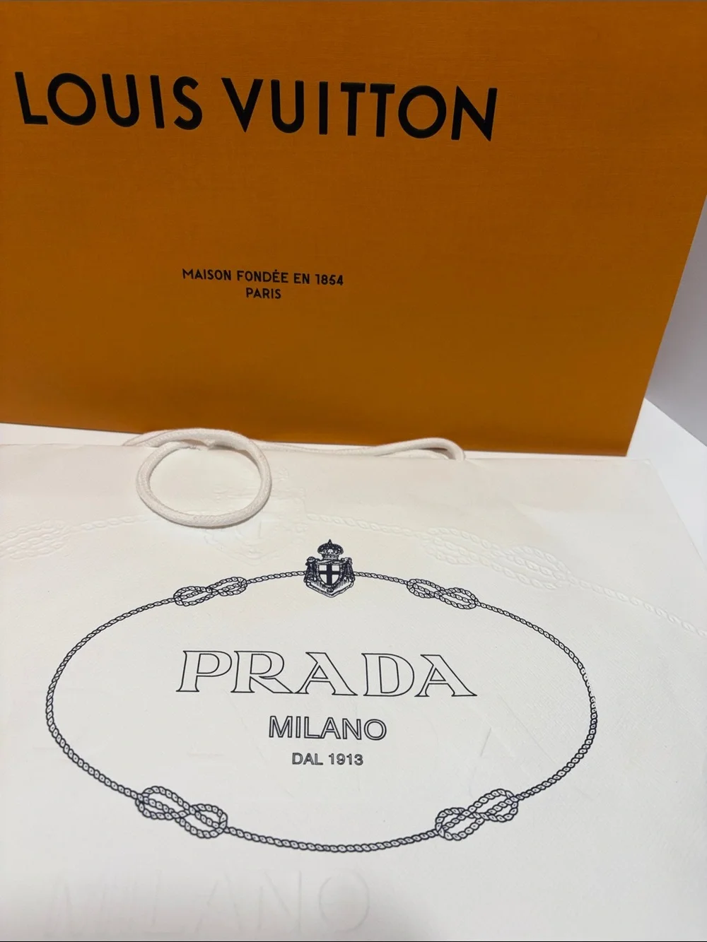 3 Louis Vuitton Orange Shopping Bag with 2 White Prada Bag